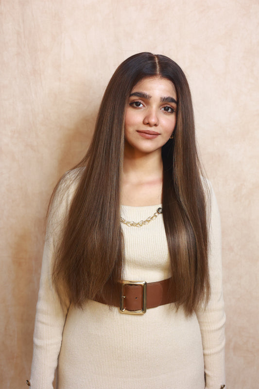 Model wearing COCO straight brown human hair wig with highlights, HD lace, glueless and clipless design, free parting, and breathable construction for all-day comfort
