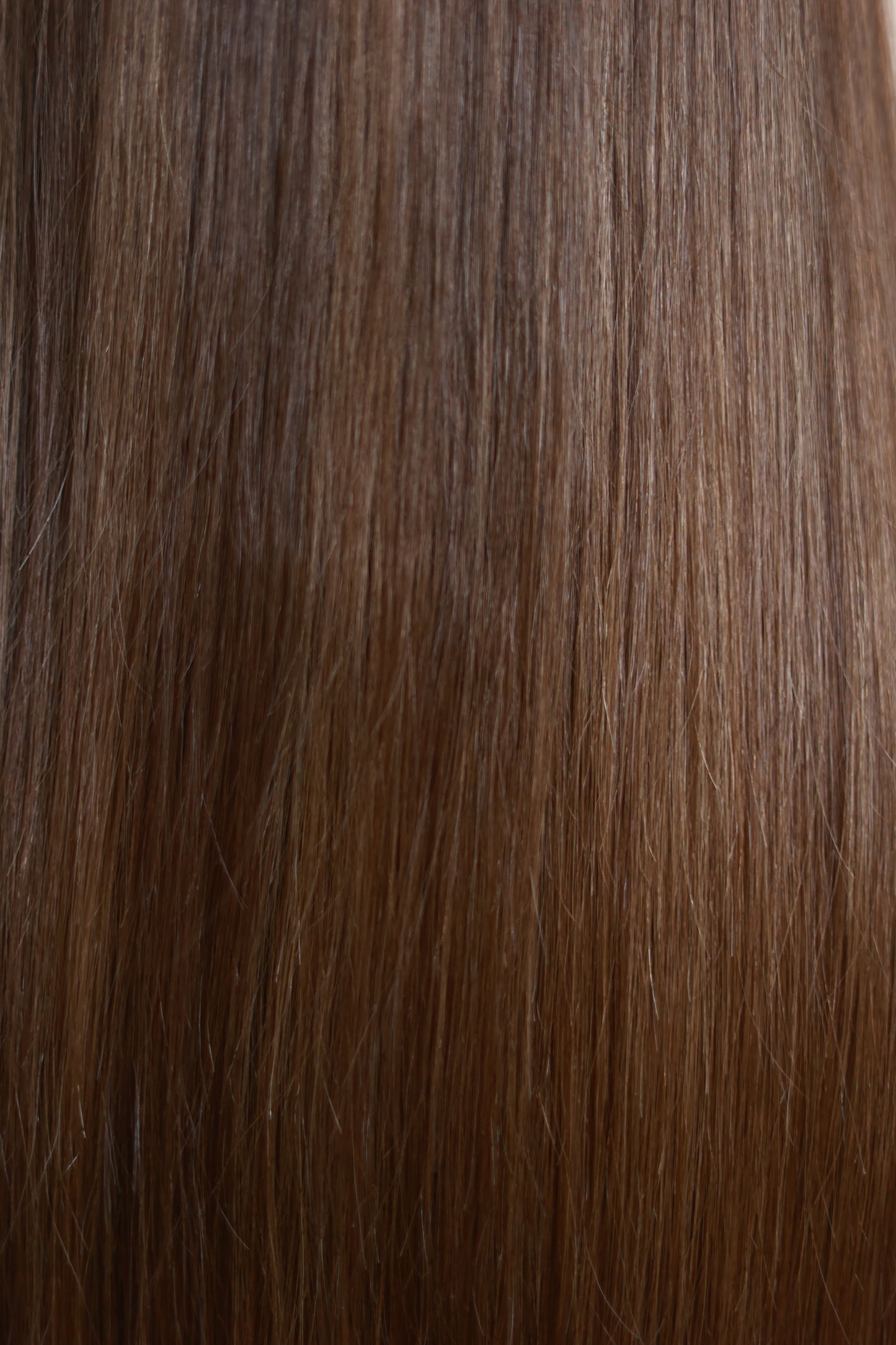 Model wearing COCO straight brown human hair wig with highlights, HD lace, glueless and clipless design, free parting, and breathable construction for all-day comfort