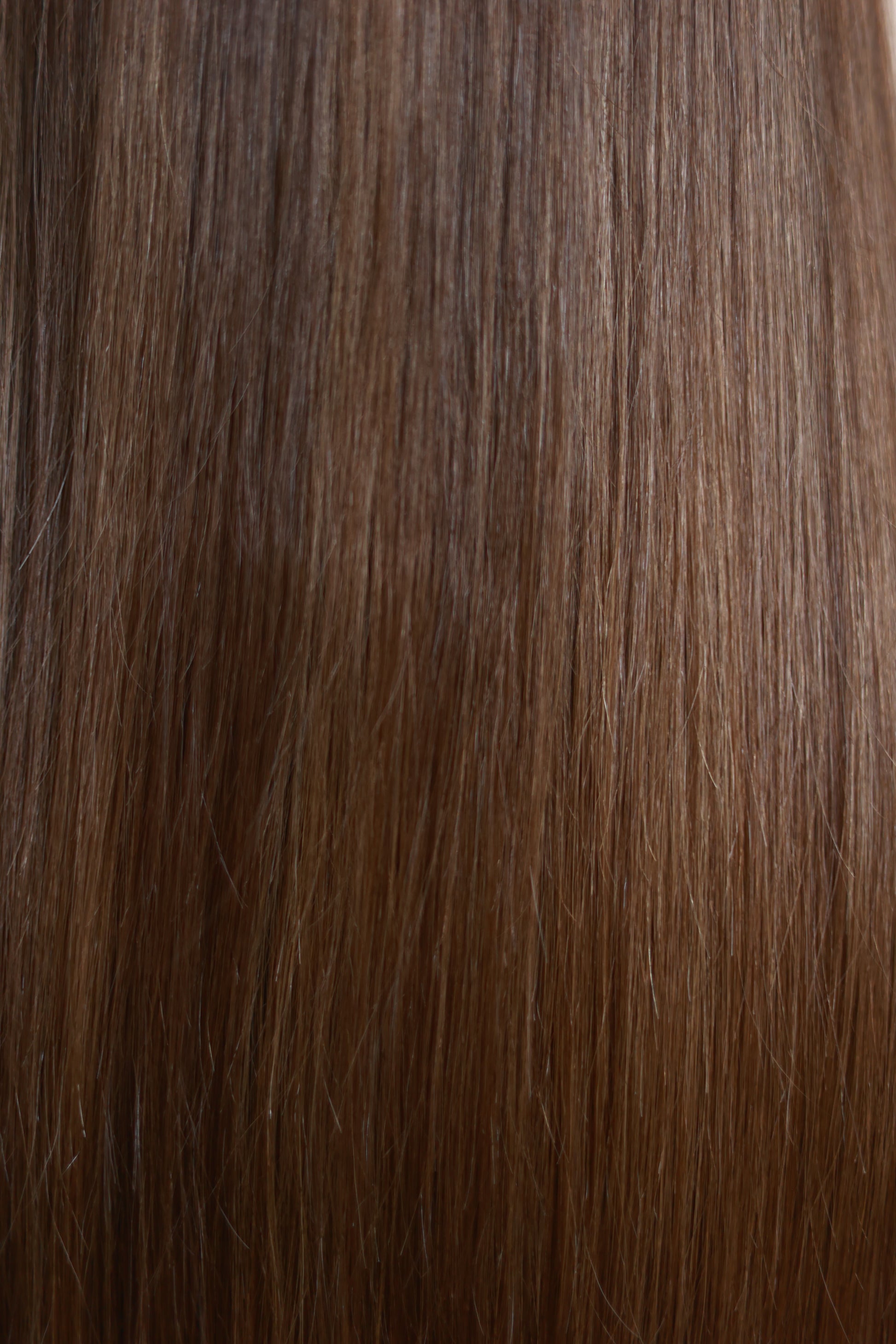 Model wearing COCO straight brown human hair wig with highlights, HD lace, glueless and clipless design, free parting, and breathable construction for all-day comfort