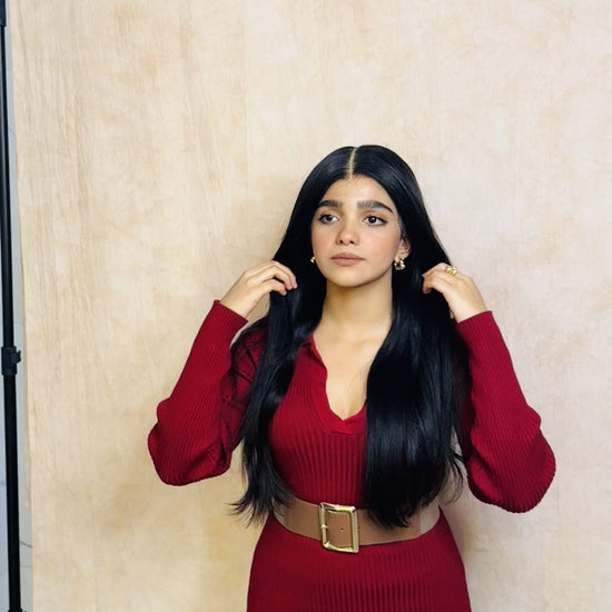 Model wearing GIGI 20-inch natural black wavy human hair wig with HD lace, glueless and clipless design, free parting, and breathable construction for all-day comfort