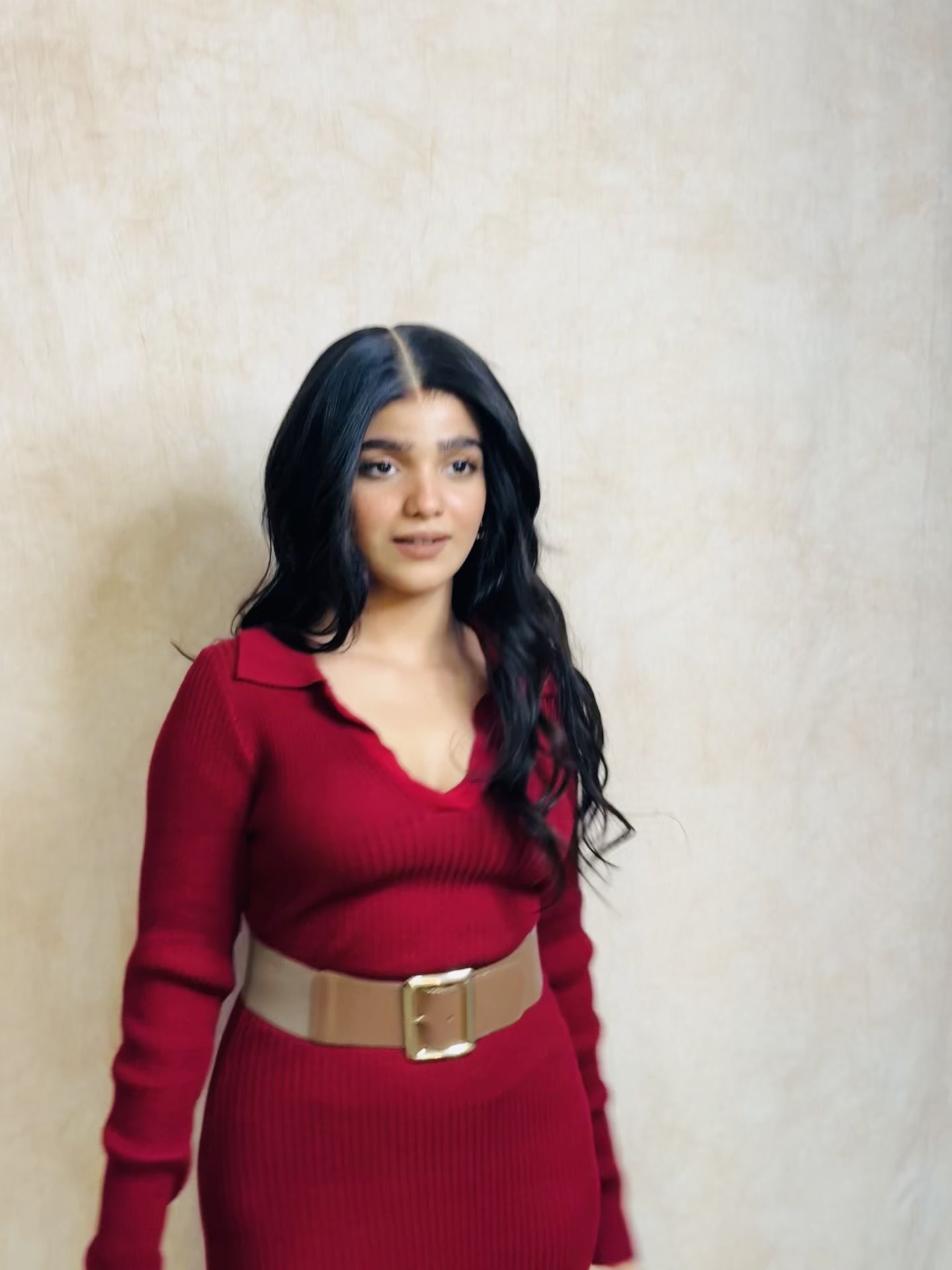 Model wearing GIGI 20-inch natural black wavy human hair wig with HD lace, glueless and clipless design, free parting, and breathable construction for all-day comfort