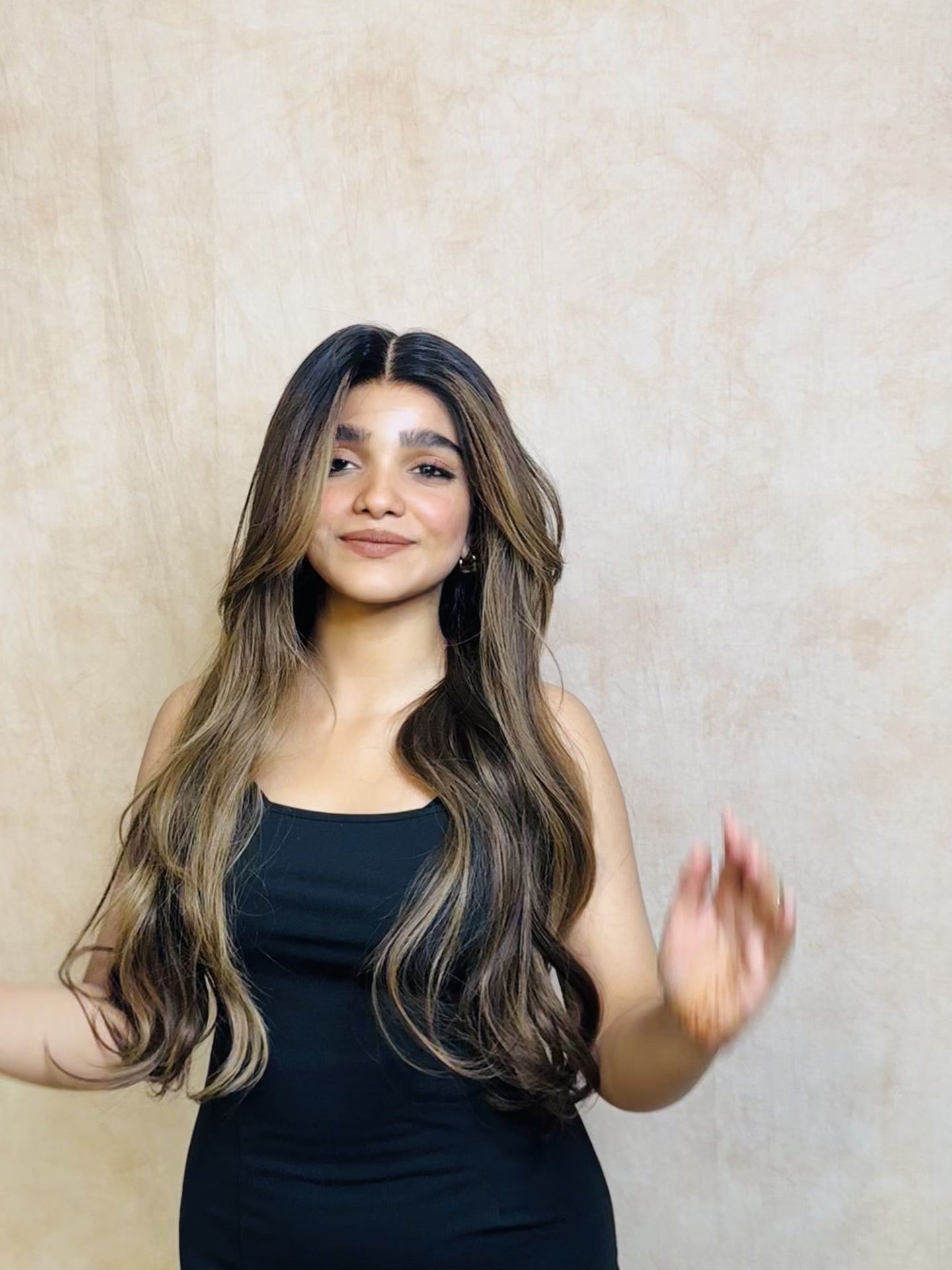 Model wearing SOPHIA 22-inch long wavy human hair wig with balayage, HD lace, glueless and clipless design, free parting, and breathable construction for all-day comfort; premium quality